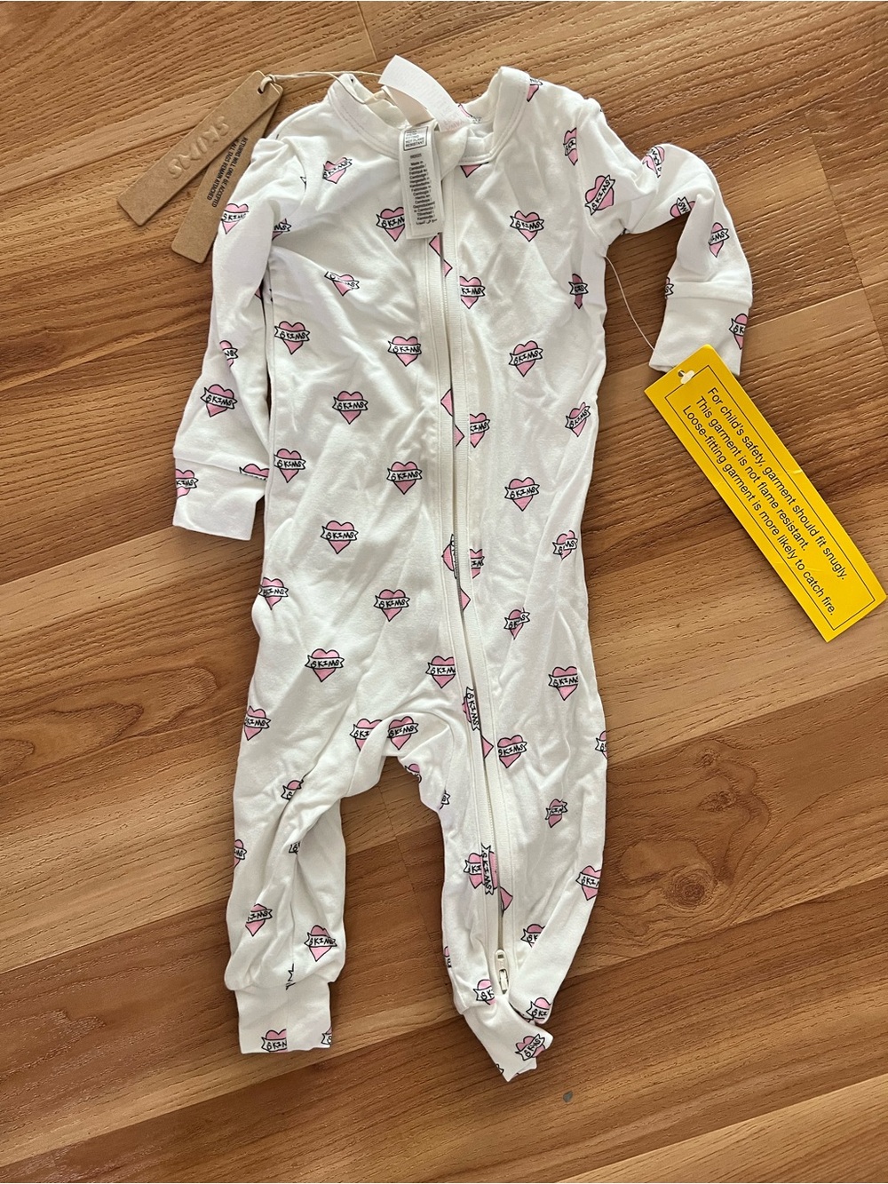 SKIMS White One-Piece Footie with Pink Heart Print